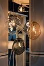 Different modern streamlined mirror glass chandeliers. Bubble transparent, metal, gold shade pendant
