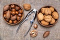 Different nuts and nutcracker close up. View from above Royalty Free Stock Photo