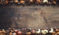 Different nuts on a wooden table. Cedar, cashew, hazelnut, walnu