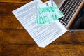 Different objects on wooden desk. Modern wooden office desk table with keyboard, documents and euro money