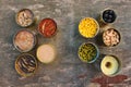 Different open canned food on old wooden background. Royalty Free Stock Photo