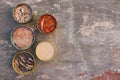 Different open canned food on old wooden background. Top view. Flat lay Royalty Free Stock Photo