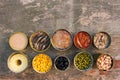 Different open canned food on old wooden background. Royalty Free Stock Photo