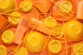 Different orange plastic items as background, closeup