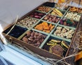 Different Oriental, Turkish nuts and sweets in a wooden box on the shop window