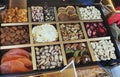 Different Oriental, Turkish nuts and sweets in a wooden box on the shop window