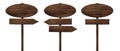 Different oval wooden direction arrow signposts or roadsigns made of dark wood