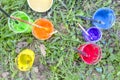 Different painting colours with brushes on a palette on a grass ground Royalty Free Stock Photo