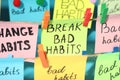 Different paper notes hanging on ropes, closeup. Break Bad Habits