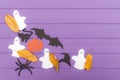 The different paper silhouettes cut out with scissors with autumn leaves made of halloween corner frame Royalty Free Stock Photo