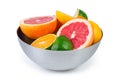 Different partly cut citrus in metal bowl