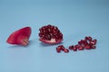 Different parts of pomegranate on light blue background