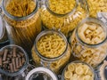 Different pasta in large glass jars