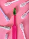 Different pastel tooth brushes pattern on color background. Many toothbrush choices for dental care and oral prevention hygiene.