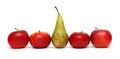 Different - pear between green apples Royalty Free Stock Photo