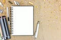 Different pencils and colorful chalks with open empty notepad on Royalty Free Stock Photo