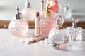 Different perfume bottles on dressing table Royalty Free Stock Photo