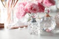 Different perfume bottles on dressing table Royalty Free Stock Photo