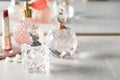 Different perfume bottles on dressing table Royalty Free Stock Photo