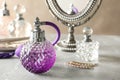 Different perfume bottles on table, space for text Royalty Free Stock Photo