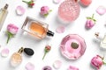 Different perfume bottles and flowers on white background, top Royalty Free Stock Photo