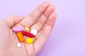 Different pills and capsules in the palm of your hand Royalty Free Stock Photo