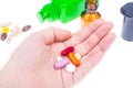 Different pills and capsules in the palm of your hand Royalty Free Stock Photo