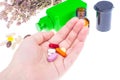 Different pills and capsules in the palm of your hand Royalty Free Stock Photo