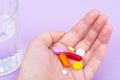 Different pills and capsules in the palm of your hand Royalty Free Stock Photo