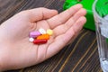 Different pills and capsules in the palm of your hand Royalty Free Stock Photo