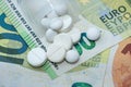 different pills on euro bills as background Royalty Free Stock Photo