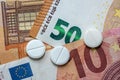 different pills on euro bills as background Royalty Free Stock Photo