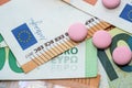 different pills on euro bills as background Royalty Free Stock Photo