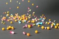 Different pills falling on table Royalty Free Stock Photo