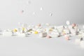 Different pills falling on table Royalty Free Stock Photo