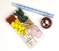 Different pills, medications, the pills in the box for drugs closeup with medicine with a syringe on white background.