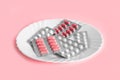 Different pills on a plate. The concept of prescription drugs for weight loss. Means for suppressing appetite