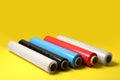 Different plastic stretch wrap films on yellow background Royalty Free Stock Photo