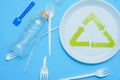 Different plastic trash and garbage recycling sign on a colored background top view. The concept of saving the planet, the Royalty Free Stock Photo