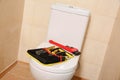 Different plumber`s tools on toilet seat lid