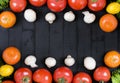 Different raw vegetables and spices on black background. Healthy eating. Autumn harvest and healthy organic food concept. Royalty Free Stock Photo