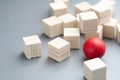 Different red ball in the group of wooden cubes Royalty Free Stock Photo