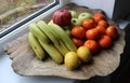 Different ripe fruits on a wooden tray indoors