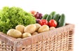 Different ripe vegetables in wicker box isolated on white Royalty Free Stock Photo