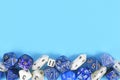 Different roleplaying RPG dice at bottom of blue background Royalty Free Stock Photo