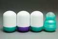 Different roll deodorant on gray background, space for text or label Royalty Free Stock Photo