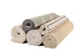 Different rolled carpets isolated on white Royalty Free Stock Photo