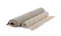 Different rolled carpets on white background Royalty Free Stock Photo