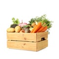 Different root vegetables in wooden crate isolated on white Royalty Free Stock Photo