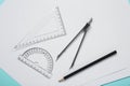 Different rulers, pencil, compass and paper sheets on turquoise background, flat lay